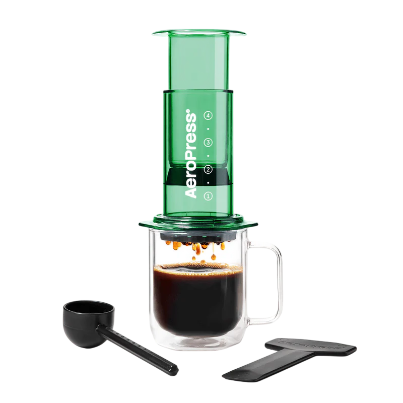 Aeropress Coffee Maker Clear - Color AeroPress Clear coffee maker in translucent green with chamber, plunger and filter cap