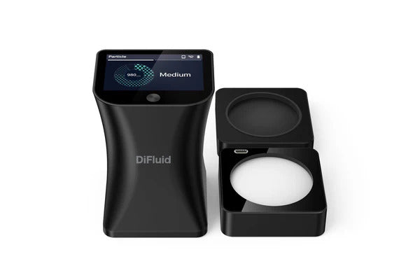 DiFluid Omni coffee grind analyzer on a café countertop
