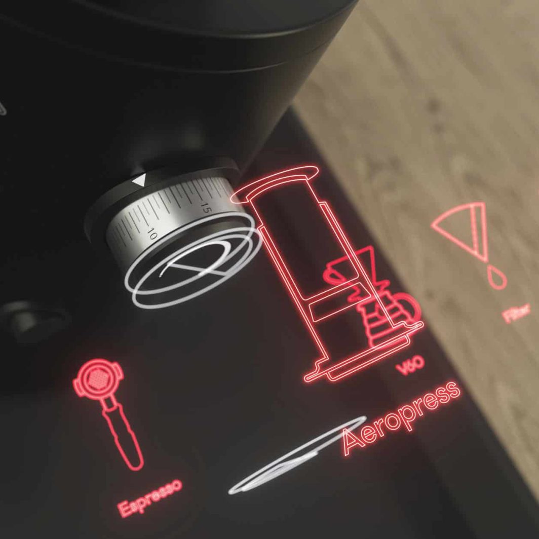 Mahlkönig X54 grinder with digital timer and chrome hopper on the counter