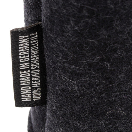 Comandante C40 felt sleeve in Anthracite wool protecting a hand grinder