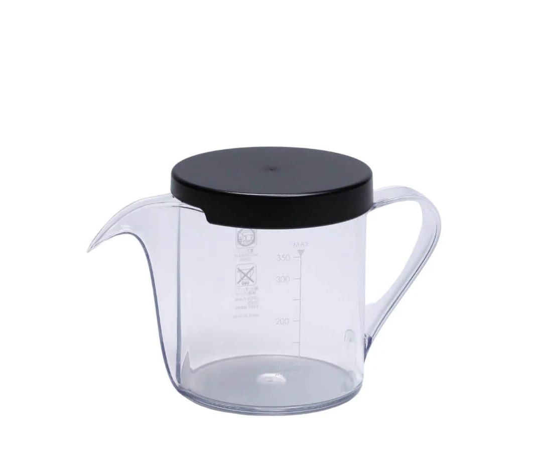 CAFEC drip kettle Osmo with orange lid on brewing counter